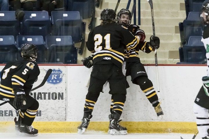 Kyle Sylvester, Jared Bethune and Koby Roth Celebrate after Sylvester's goal. (Photo / Bruce Brierley, East Grand Forks Exponent)