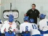 Featured Image: St. Cloud Cathedral coach Eric Johnson instructs his young team during preseason scrimmages in Moorhead in late November. (Photo / Tim Kolehmainen)