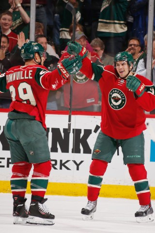 Jason Pominville #29 and Zach Parise #11 of the Minnesota Wild celebrate after scoring a goal against the Edmonton Oilers during the game on March 11, 2014 at the Xcel Energy Center in St. Paul, Minnesota. (Photo by Bruce Kluckhohn/NHLI via Getty Images)