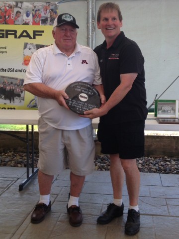 Long-time Cottage Grove youth coach, John Mausolf, receives The MHM Lifetime Achievement Award from MHM President, Scott Tiffany.