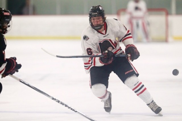 Lakeville North’s Max Johnson chips the puck up ice during the Panthers’ Jan. 13 2-1 victory over Duluth East. (Photo by Jim Lindquist/sidekick.smugmug.com)