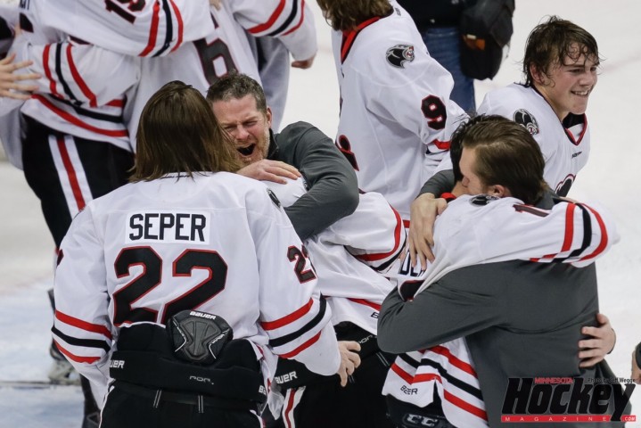 Lakeville North coach Trent  Eigner celebrates with his players after the Panthers' defeated Duluth East in the Class 2A championship game on Saturday, March 7 at Xcel Energy Center (MHM Photo / Jeff Wegge)