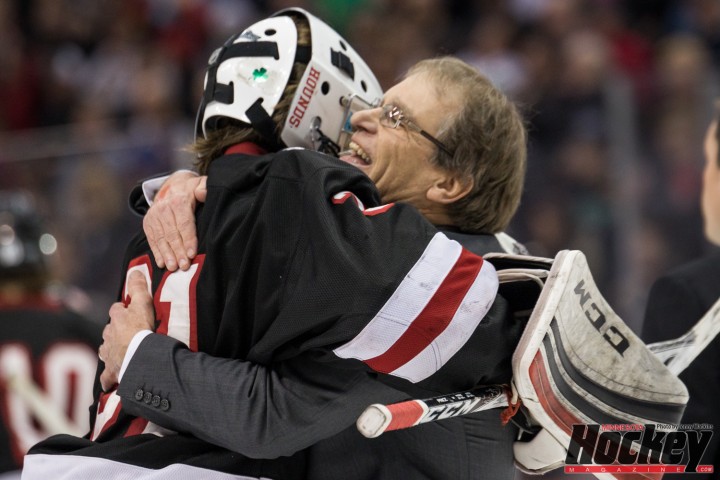 Mike Randolph embraces Greyhounds' goaltender Gunner Howg after Duluth East's improbable win over Edina. (MHM Photo / Jonathan Watkins)  